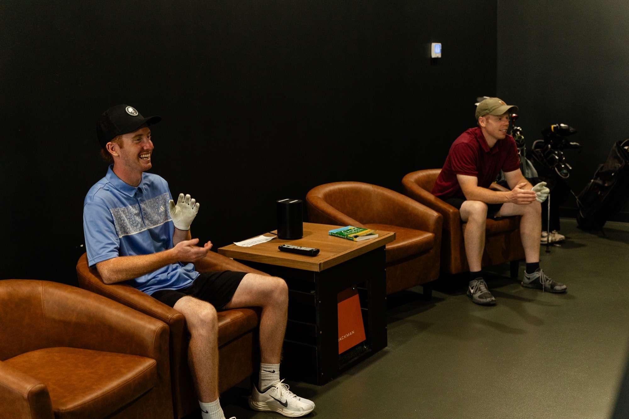 Guests laughing in Virtual Greens lobby